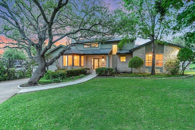 8105 Bell Mountain Dr, Austin, TX 78730 - view of front of house featuring a front lawn, stone siding, and covered porch