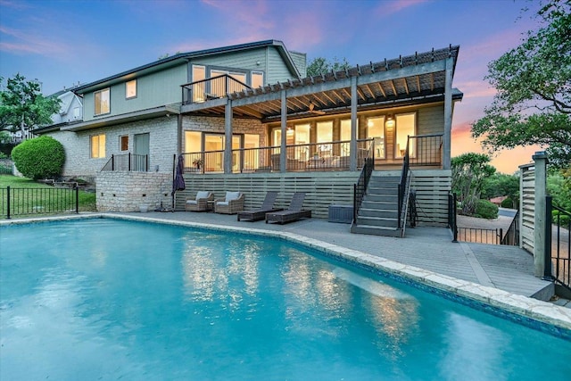 8105 Bell Mountain Dr, Austin, TX 78730 - rear view of property featuring stairs, a balcony, stone siding, and a deck