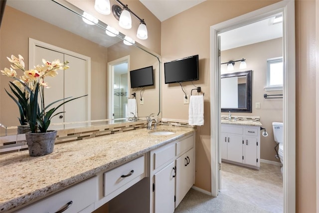 1609 Oak Forest Dr, Round Rock, TX 78681 - bathroom with vanity, toilet, baseboards, and tile patterned floors