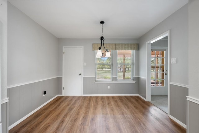 1609 Oak Forest Dr, Round Rock, TX 78681 - unfurnished dining area with wood finished floors and baseboards