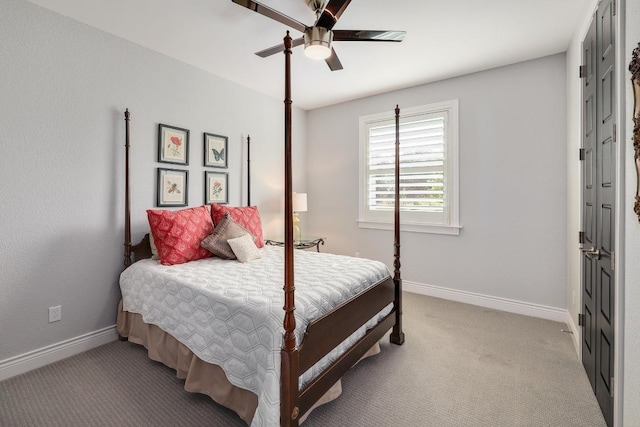 carpeted bedroom featuring a ceiling fan and baseboards
