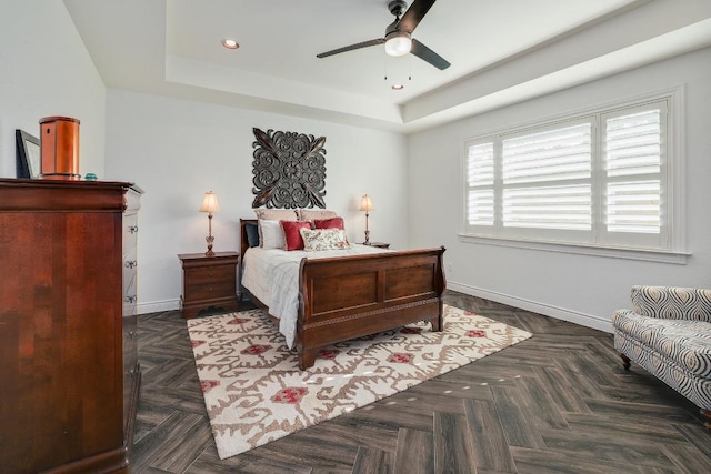 bedroom featuring recessed lighting, ceiling fan, baseboards, and a raised ceiling
