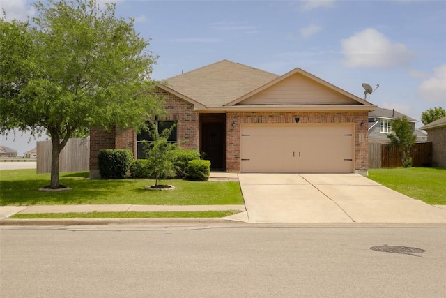 single story home featuring concrete driveway, a front lawn, fence, a garage, and brick siding