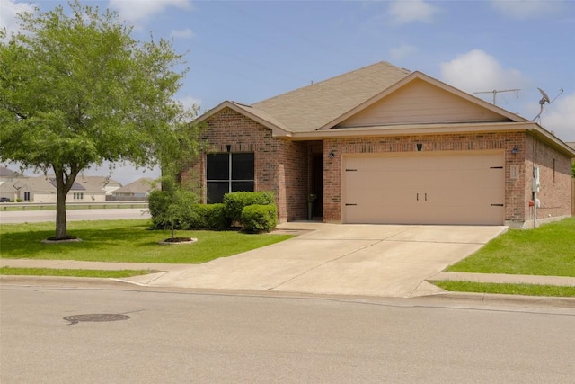 view of front facade featuring driveway, a front lawn, brick siding, and a garage