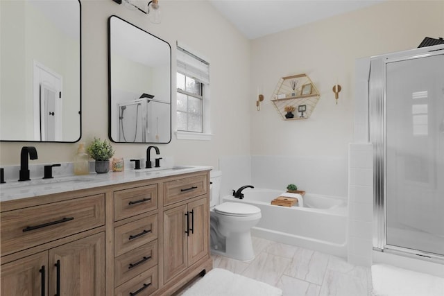 full bath with a shower stall, marble finish floor, double vanity, a sink, and a garden tub