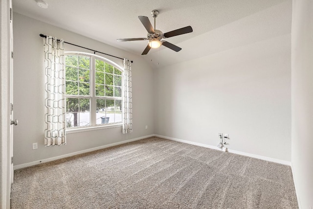unfurnished room featuring baseboards, a ceiling fan, and carpet flooring