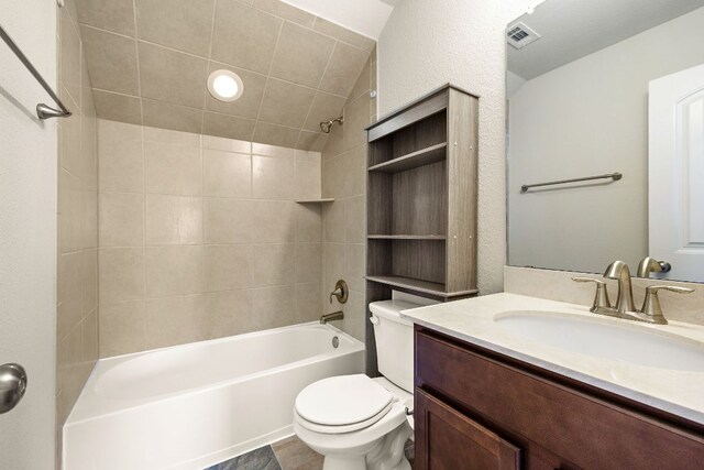 full bath featuring washtub / shower combination, visible vents, toilet, and vanity