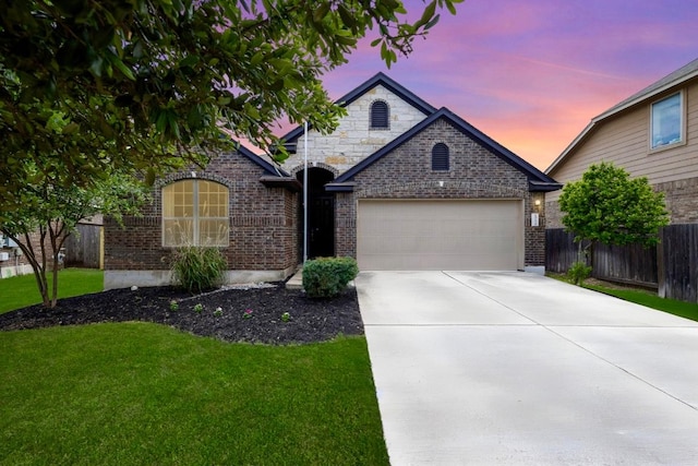 1512 Daylily Loop, Georgetown, TX 78626 - view of front of property featuring brick siding, a garage, and driveway