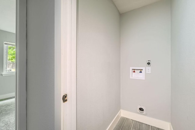 washroom featuring washer hookup, laundry area, baseboards, and hookup for an electric dryer
