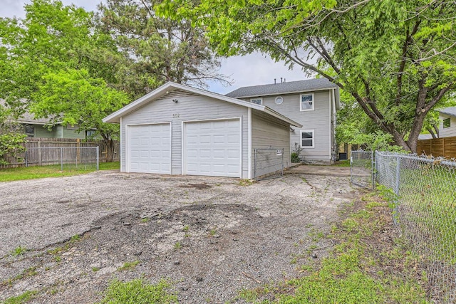502 Capitol Dr, Austin, TX 78753 - view of front of home with a detached garage and an outbuilding