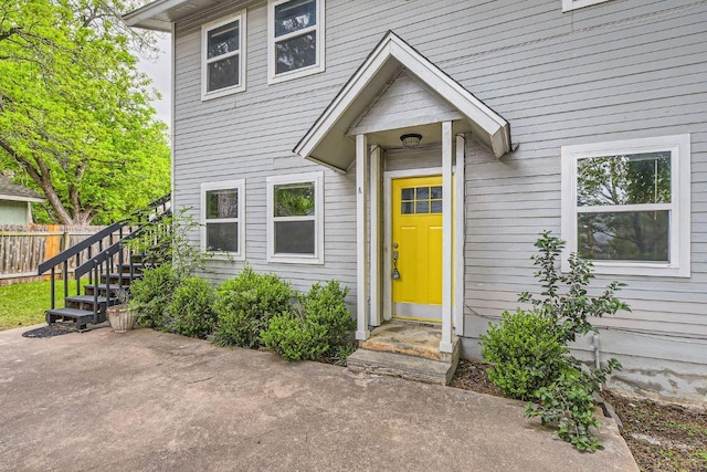 exterior space featuring fence, a patio area, and stairs