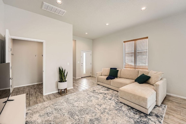 11509 Brindle Ct, Manor, TX 78653 - living room with recessed lighting, wood finished floors, and baseboards