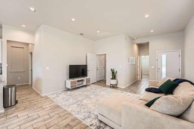 11509 Brindle Ct, Manor, TX 78653 - living room with light wood-type flooring, recessed lighting, and baseboards