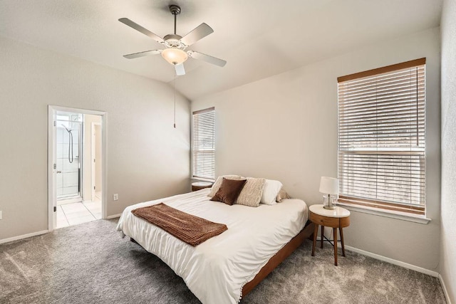 11509 Brindle Ct, Manor, TX 78653 - bedroom featuring carpet flooring, multiple windows, baseboards, connected bathroom, and vaulted ceiling