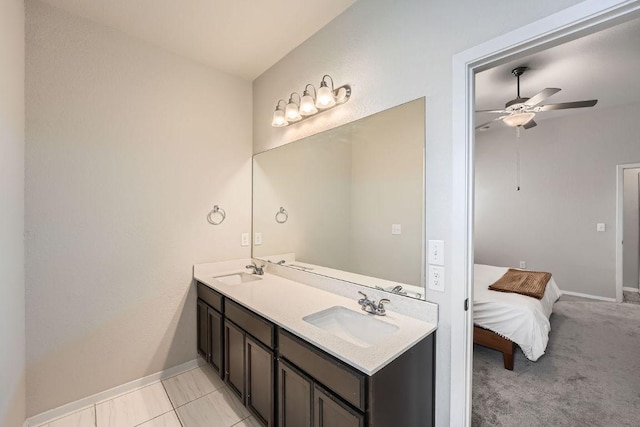 11509 Brindle Ct, Manor, TX 78653 - bathroom featuring double vanity, ceiling fan, and baseboards
