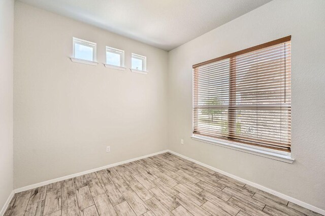 11509 Brindle Ct, Manor, TX 78653 - spare room with wood finished floors and baseboards