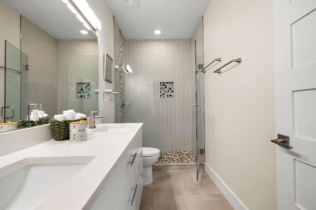 4709 Bandera Rd, Austin, TX 78721 - full bathroom featuring a stall shower, double vanity, tile patterned flooring, and recessed lighting