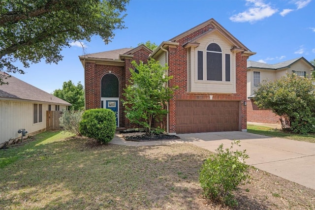 17320 Manish Dr, Pflugerville, TX 78660 - view of front of property featuring driveway, brick siding, and an attached garage