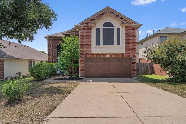 17320 Manish Dr, Pflugerville, TX 78660 - view of front of property with a garage, brick siding, and driveway
