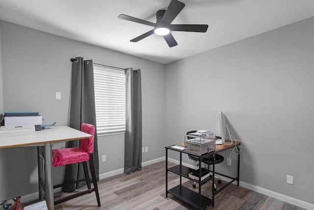 17320 Manish Dr, Pflugerville, TX 78660 - office space with a ceiling fan, wood finished floors, and baseboards