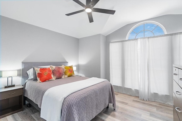 17320 Manish Dr, Pflugerville, TX 78660 - bedroom with vaulted ceiling, light wood-style floors, and a ceiling fan