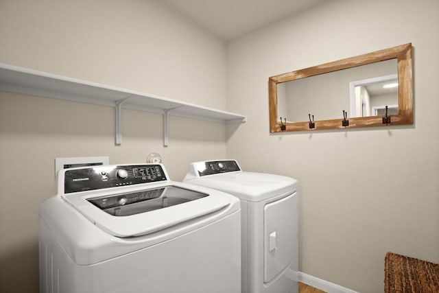 604 Nueces River Trl, Hutto, TX 78634 - laundry area featuring baseboards, independent washer and dryer, and laundry area