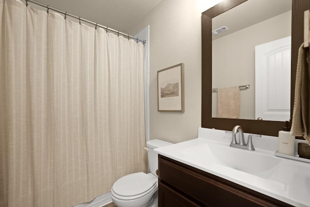 604 Nueces River Trl, Hutto, TX 78634 - bathroom featuring toilet, vanity, and a shower with shower curtain