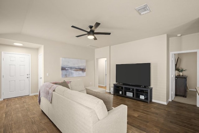 604 Nueces River Trl, Hutto, TX 78634 - living area with dark wood finished floors, baseboards, ceiling fan, and visible vents