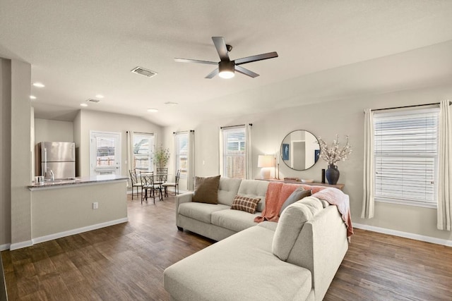 604 Nueces River Trl, Hutto, TX 78634 - living room with baseboards, a ceiling fan, visible vents, and dark wood-style floors