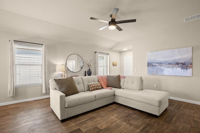 604 Nueces River Trl, Hutto, TX 78634 - living room with vaulted ceiling, visible vents, a ceiling fan, dark wood-type flooring, and baseboards