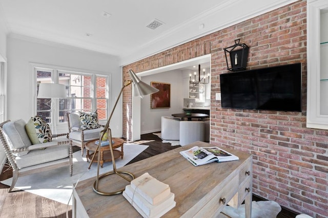 2702 Hillview Green Ln, Austin, TX 78703 - interior space featuring wood finished floors, brick wall, crown molding, and a chandelier