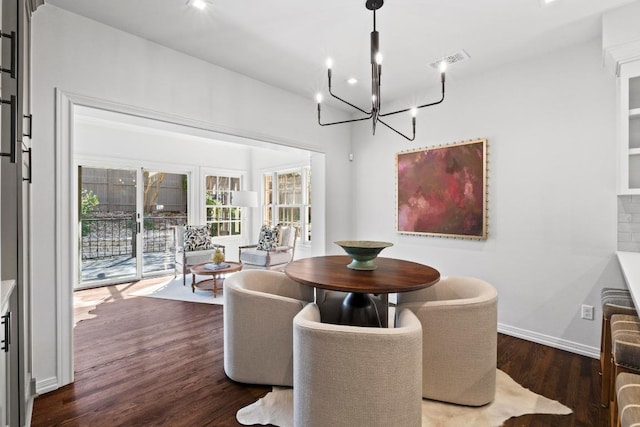 2702 Hillview Green Ln, Austin, TX 78703 - dining space with a chandelier and wood finished floors