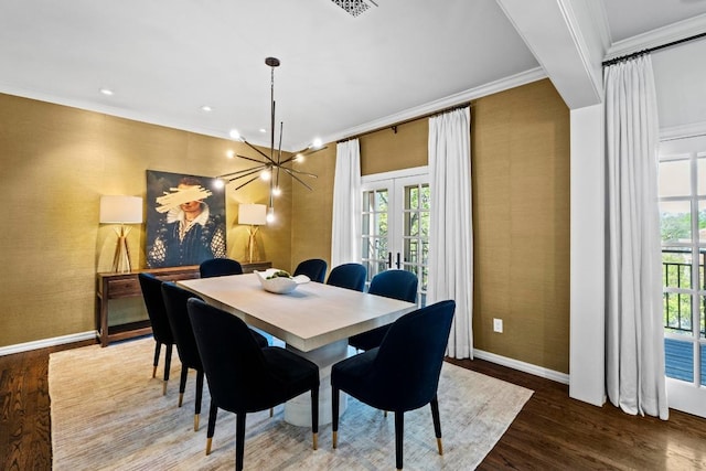2702 Hillview Green Ln, Austin, TX 78703 - dining area featuring wallpapered walls, ornamental molding, french doors, wood finished floors, and healthy amount of natural light