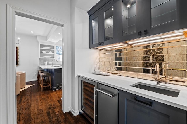 2702 Hillview Green Ln, Austin, TX 78703 - indoor wet bar with wine cooler, decorative backsplash, dark wood finished floors, and recessed lighting