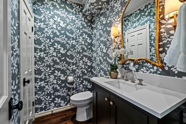 2702 Hillview Green Ln, Austin, TX 78703 - bathroom featuring wallpapered walls, wood finished floors, and vanity