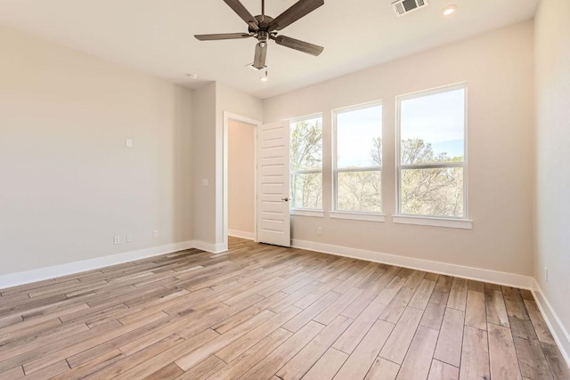 spare room with light wood-style flooring, baseboards, visible vents, recessed lighting, and ceiling fan