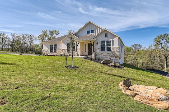 craftsman-style home featuring stone siding, a front lawn, board and batten siding, and stucco siding