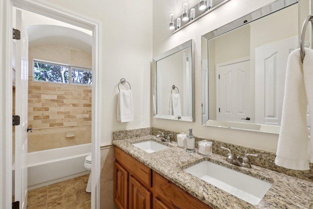1900 Val Verde Dr, Austin, TX 78732 - full bathroom featuring toilet, a bath, double vanity, and a sink