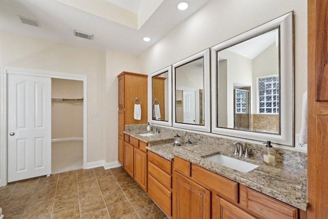 1900 Val Verde Dr, Austin, TX 78732 - bathroom featuring a sink, a spacious closet, and visible vents