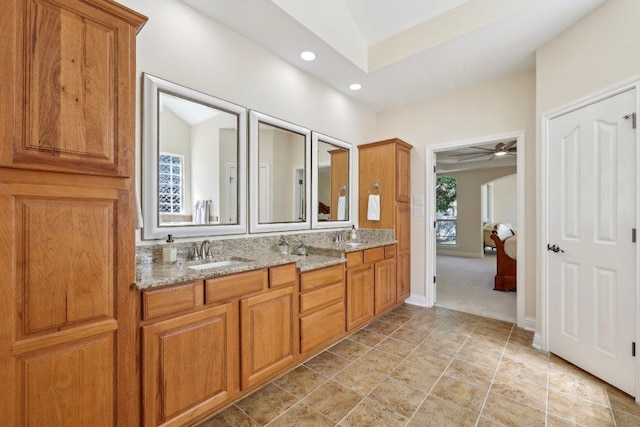 1900 Val Verde Dr, Austin, TX 78732 - full bathroom with a sink, ceiling fan, double vanity, baseboards, and recessed lighting