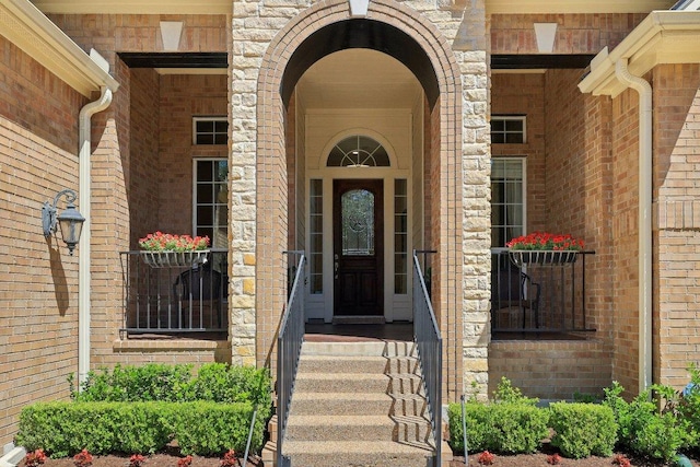 1900 Val Verde Dr, Austin, TX 78732 - view of exterior entry with a porch and brick siding