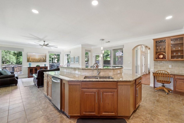 1900 Val Verde Dr, Austin, TX 78732 - kitchen with crown molding, open floor plan, a sink, and an island with sink