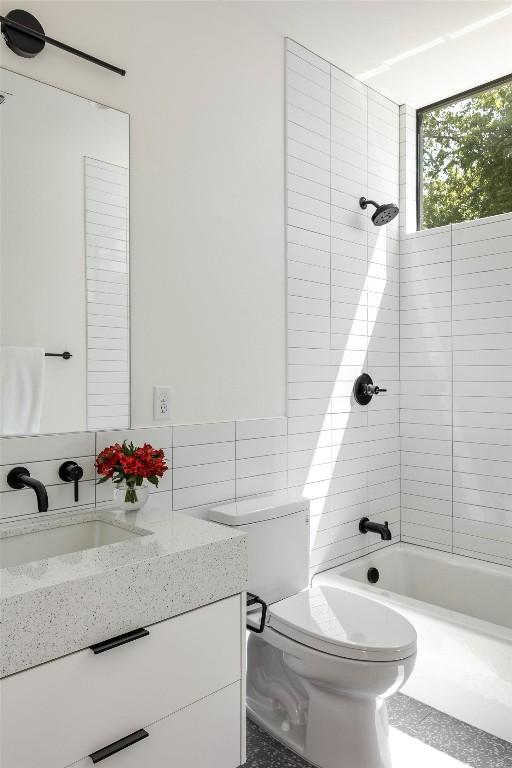 303 W Elizabeth St Unit A, Austin, TX 78704 - full bath with vanity, bathing tub / shower combination, and tile walls
