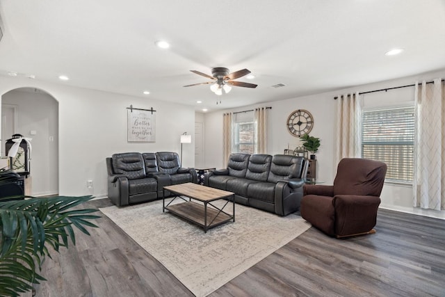 153 Proclamation Ave, Liberty Hill, TX 78642 - living area with plenty of natural light, a ceiling fan, arched walkways, and recessed lighting