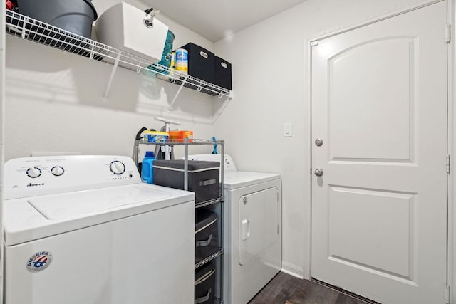 153 Proclamation Ave, Liberty Hill, TX 78642 - laundry area featuring washing machine and dryer, dark wood finished floors, and laundry area