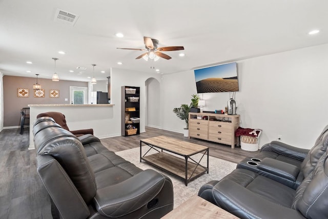 153 Proclamation Ave, Liberty Hill, TX 78642 - living area with arched walkways, visible vents, recessed lighting, a ceiling fan, and wood finished floors