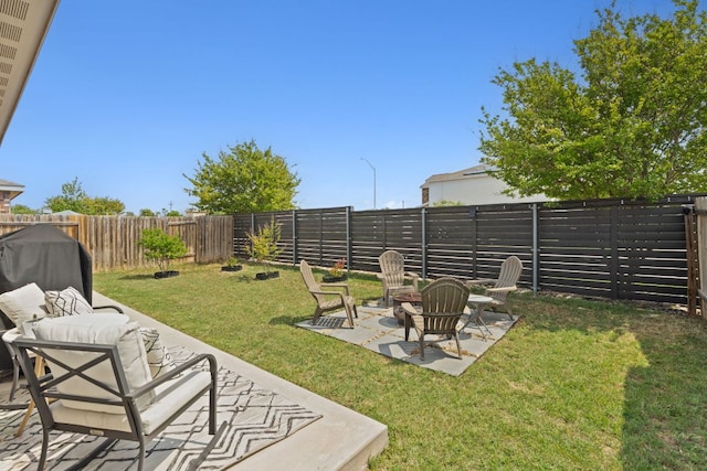 153 Proclamation Ave, Liberty Hill, TX 78642 - view of yard featuring a patio area, a fenced backyard, and an outdoor fire pit