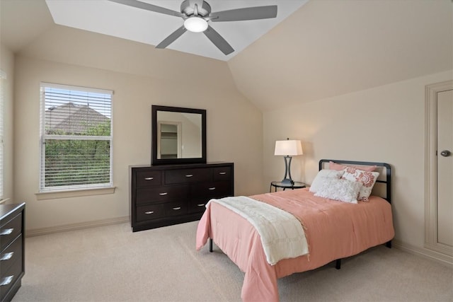 2418 Silent Brook Trl, Round Rock, TX 78665 - bedroom featuring light colored carpet, vaulted ceiling, baseboards, and a ceiling fan