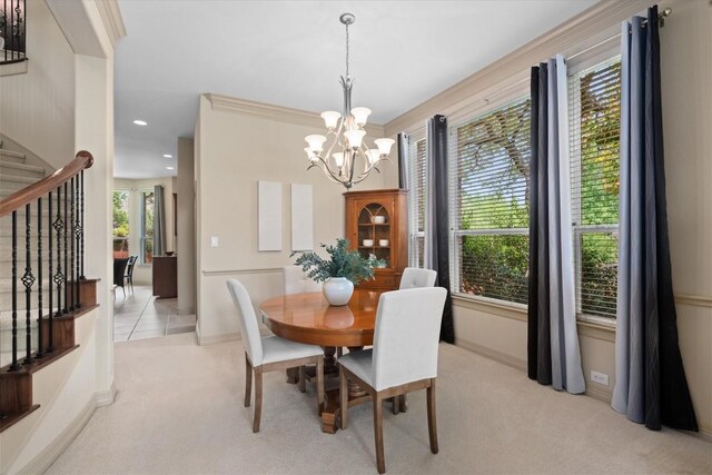 2418 Silent Brook Trl, Round Rock, TX 78665 - dining area with light carpet, stairs, a chandelier, and recessed lighting