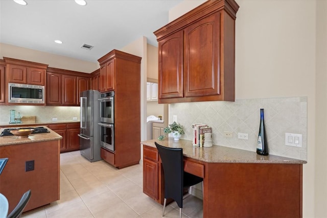 2418 Silent Brook Trl, Round Rock, TX 78665 - kitchen featuring stainless steel appliances, backsplash, light stone countertops, light tile patterned flooring, and recessed lighting